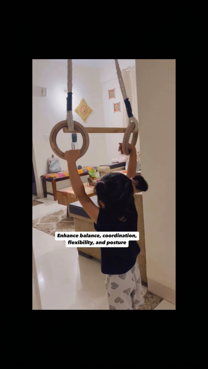 Child using a pull-up bar in a home setting with text overlay about physical benefits.